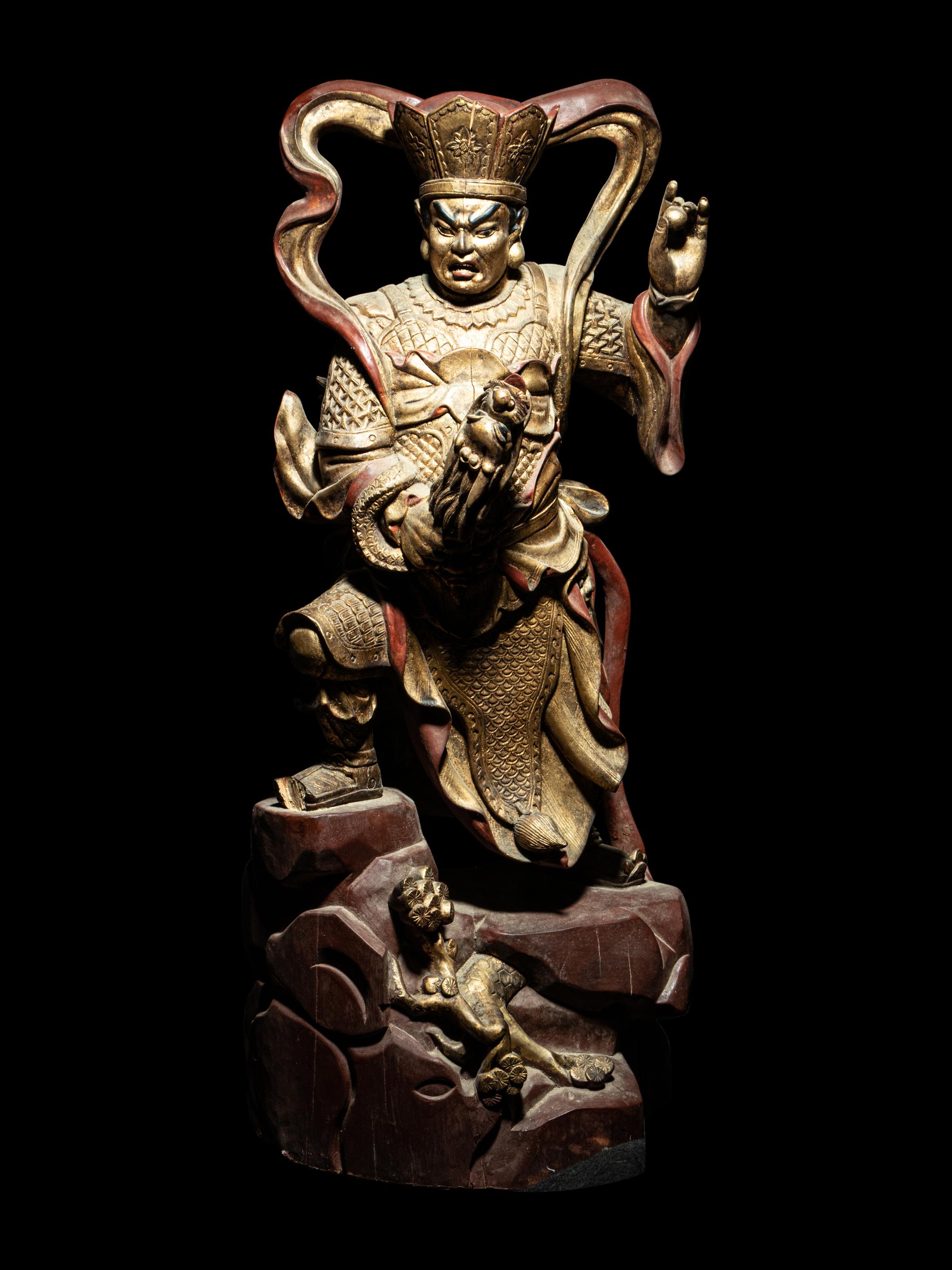 A Set of Four Gilt and Red Lacquered Wood Figures of Guardians