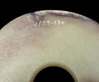 A Russet and Celadon Jade Bi Disc