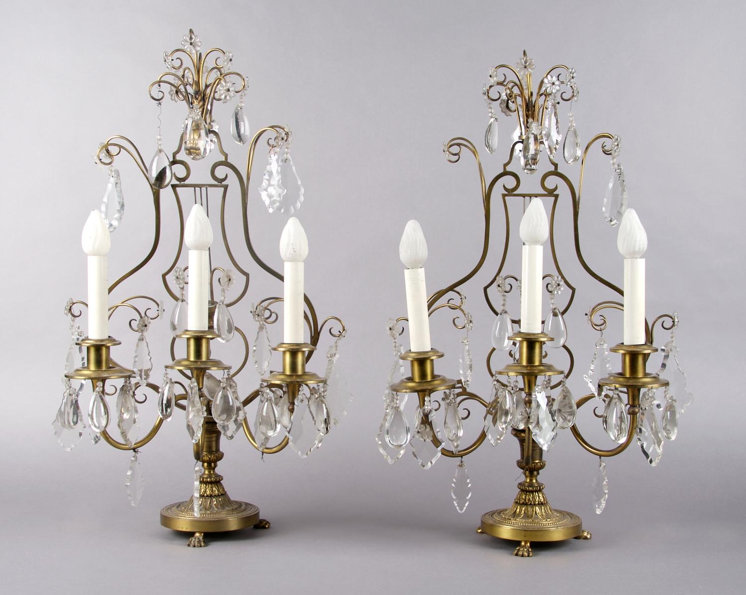 A Pair of Gilt Metal Three-Light Candelabra, Height 23 1/2 inches.