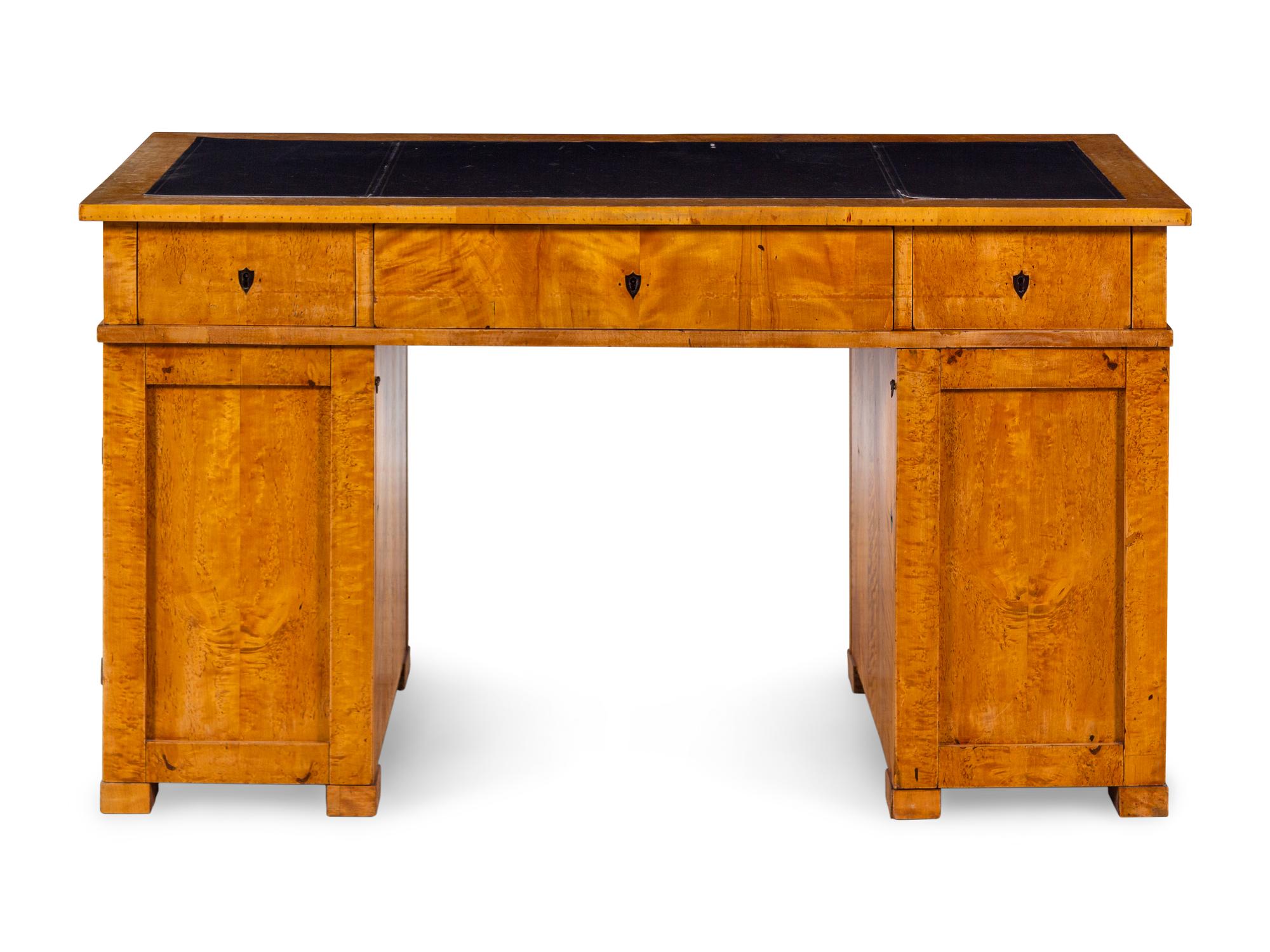 A Swedish Biedermeier Birch Pedestal Desk