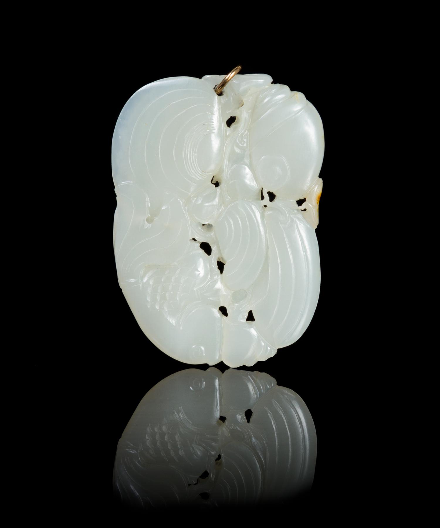 A Carved Jade Pendant Length 2 1/4 inches.