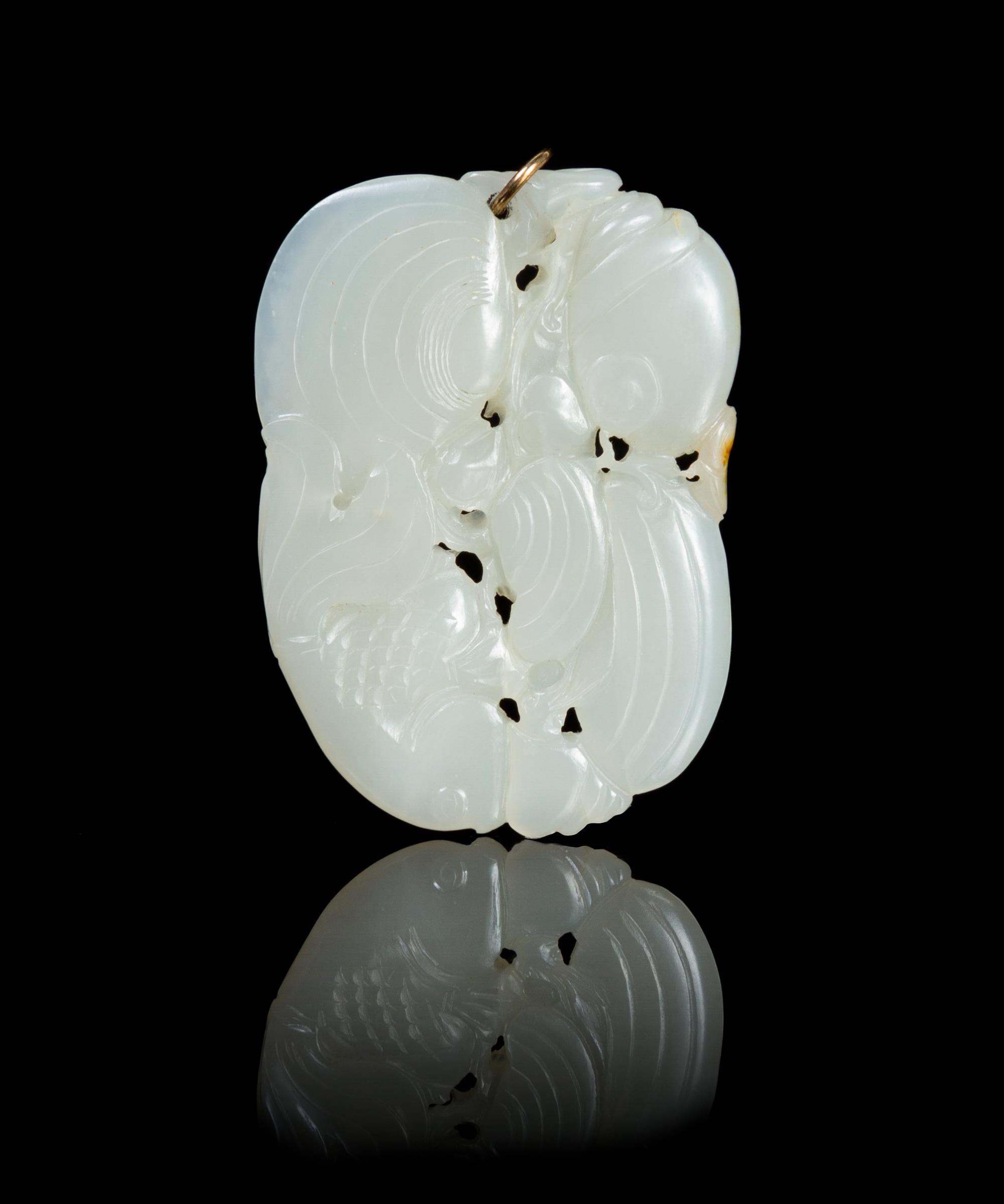 A Carved Jade Pendant Length 2 1/4 inches.