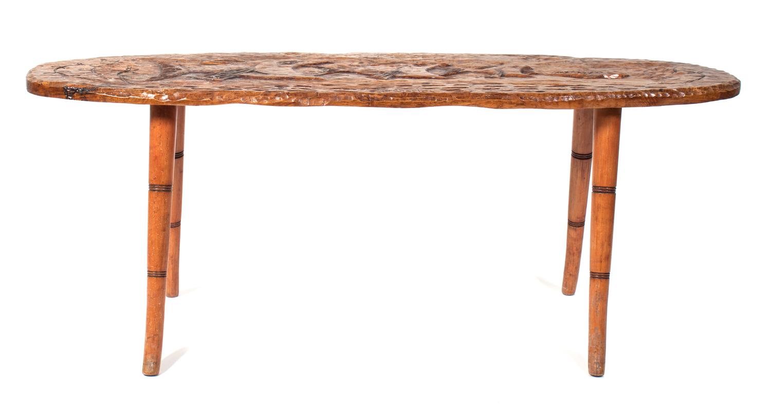 An American Carved Occasional Table Width 52 inches. — MID 20TH CENTURY