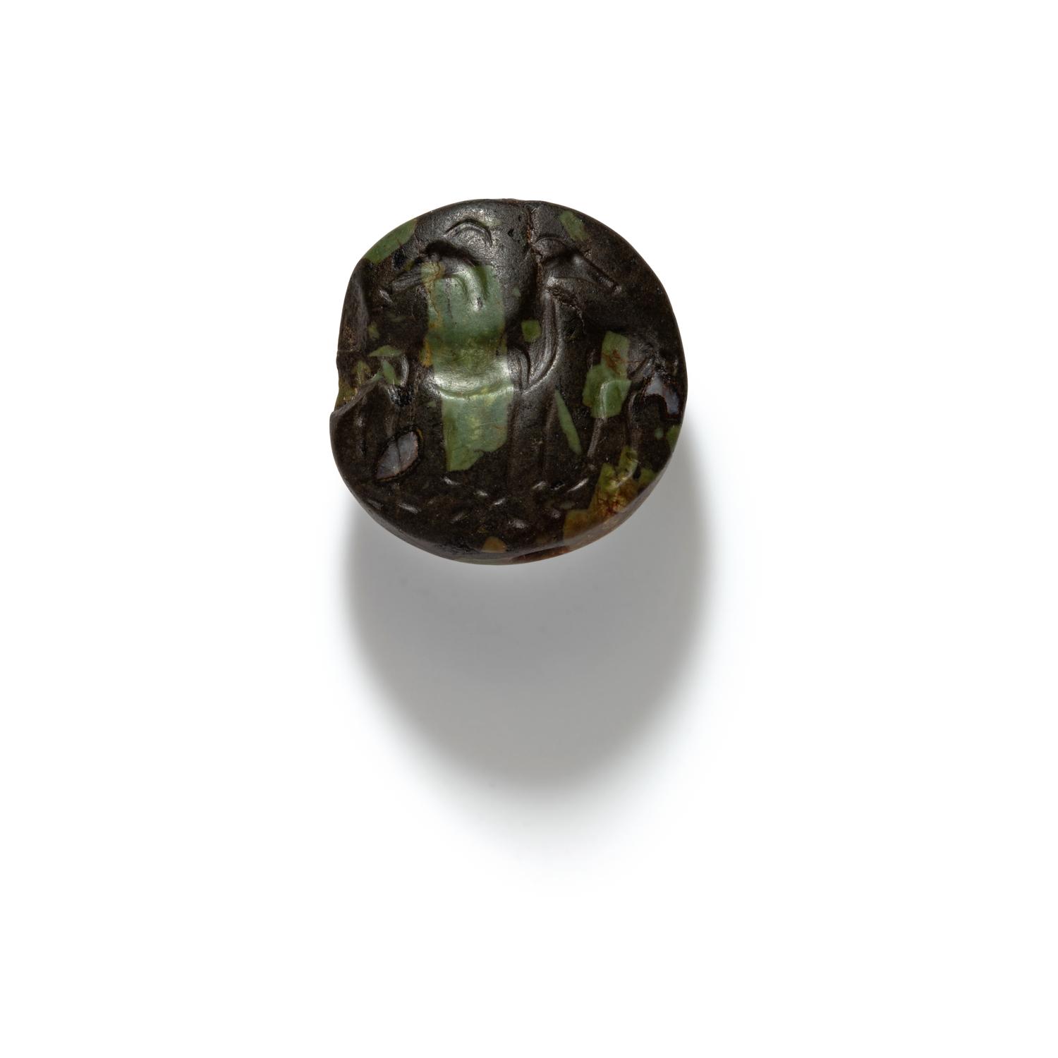 A Minoan Green Porphyry Lentoid with Two Gazelles