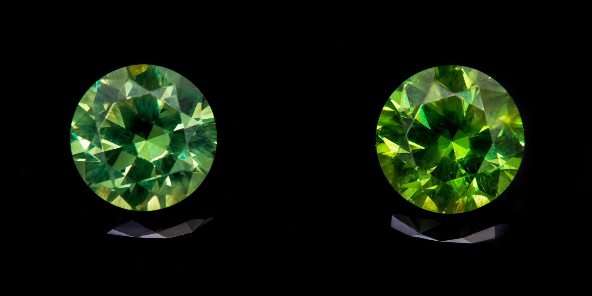 A Pair of Round Brilliant Cut Russian Demantoid Garnets Weighing 4.63 Carats Total,
