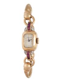 TIFFANY & CO., YELLOW GOLD, RUBY AND DIAMOND WATCH