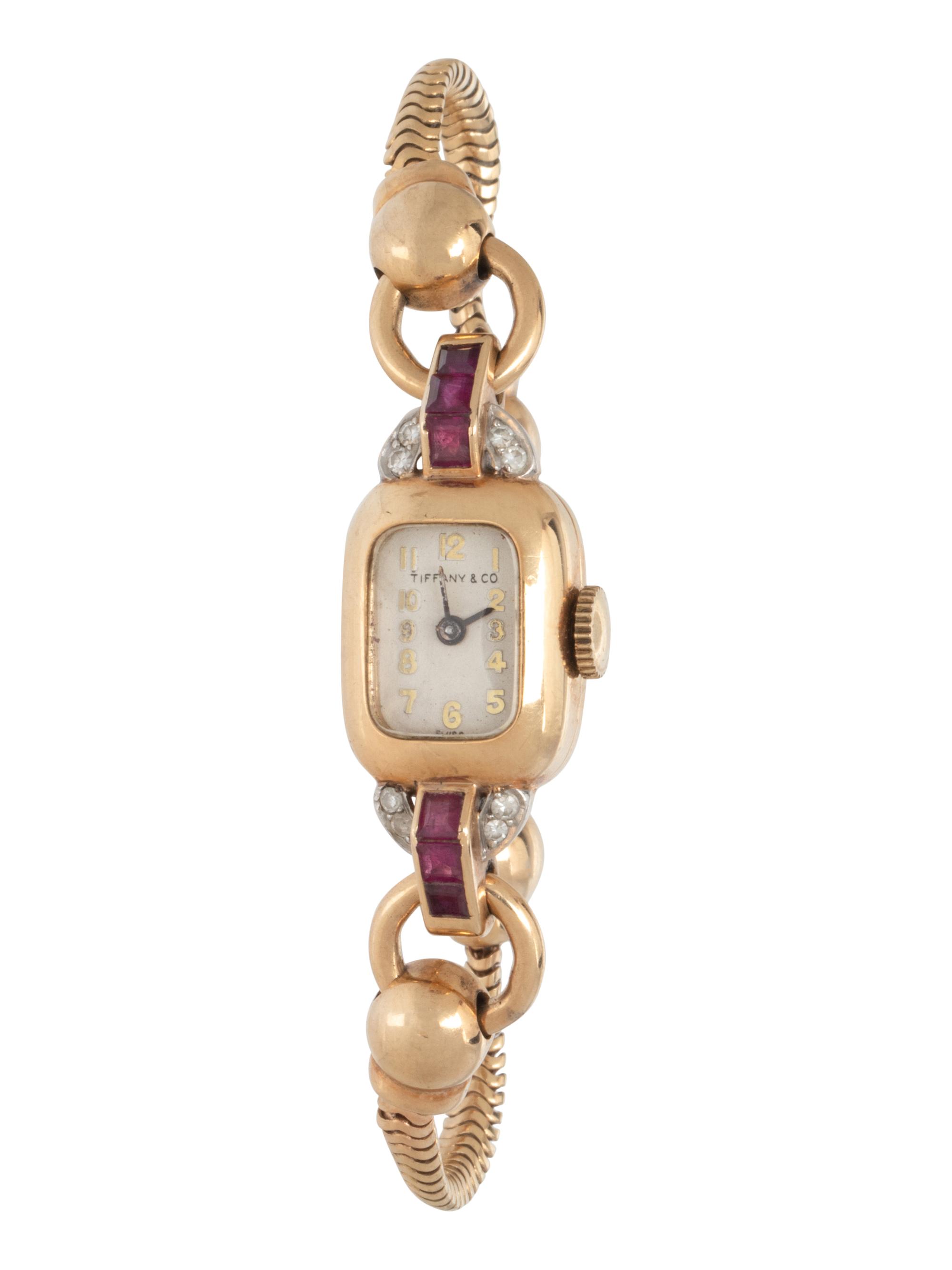 TIFFANY & CO., YELLOW GOLD, RUBY AND DIAMOND WATCH