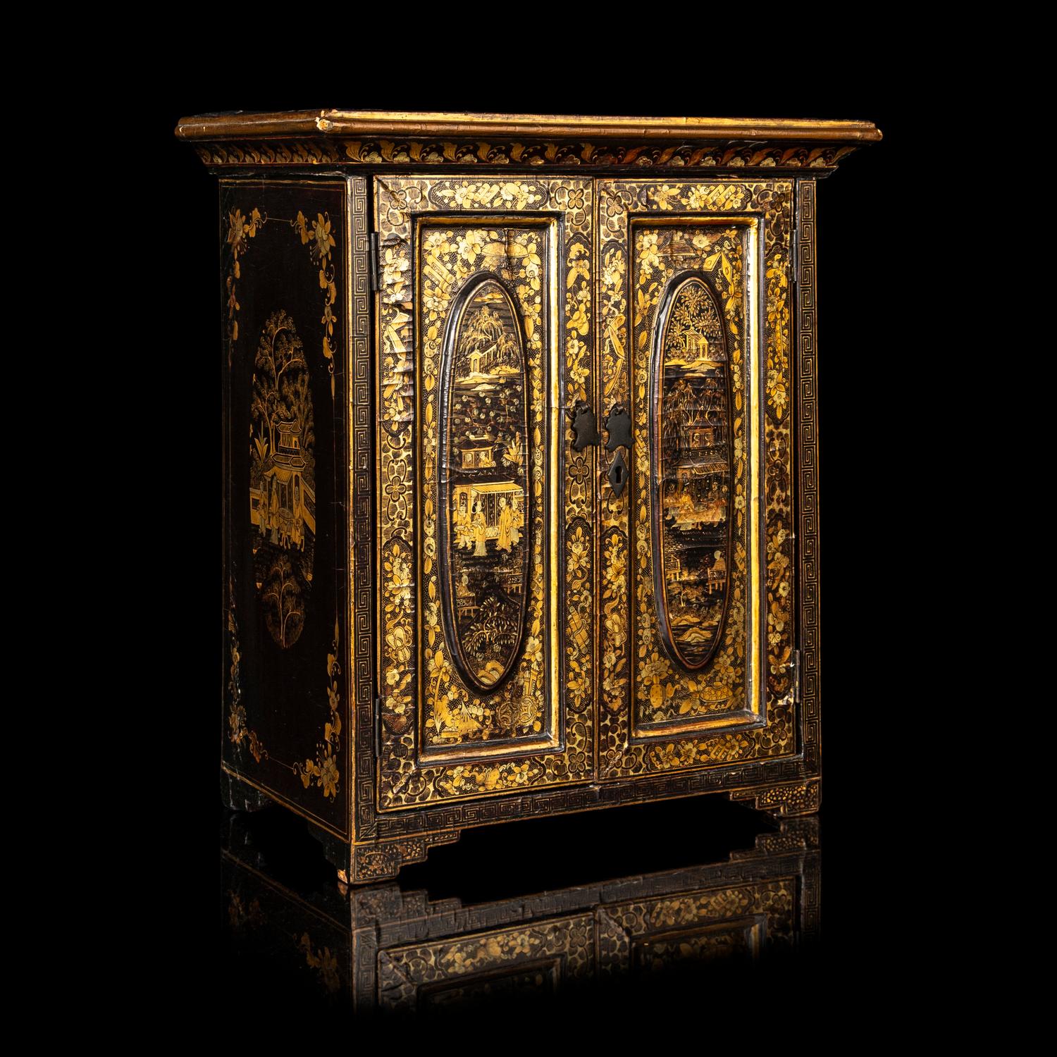 A Chinese Export Gilt Decorated Black Lacquered Chest