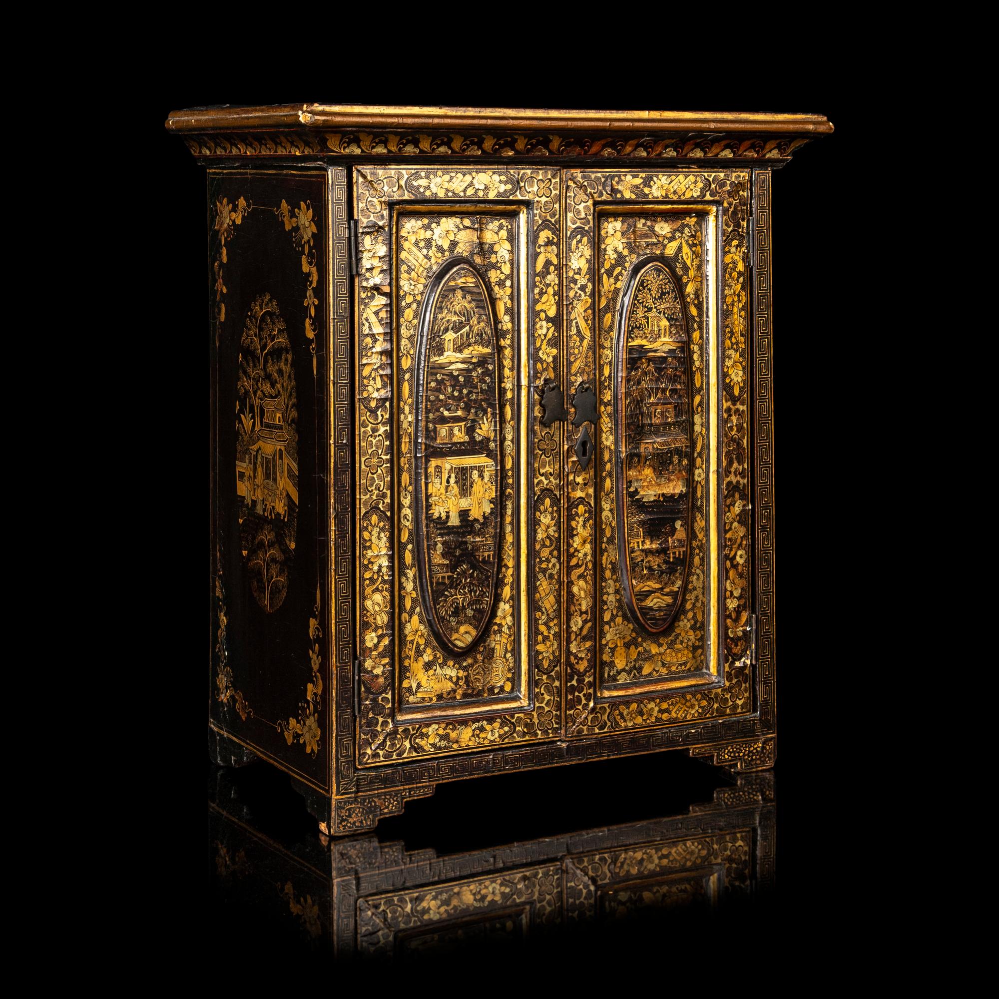 A Chinese Export Gilt Decorated Black Lacquered Chest