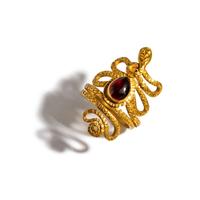An Egyptian Gold and Garnet Snake Ring