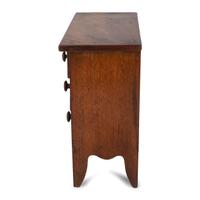 A Federal Inlaid and Carved Cherrywood Diminutive Chest of Drawers
