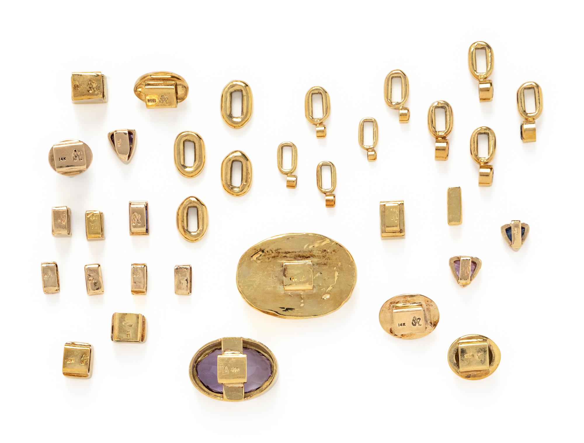COLLECTION OF BEZEL SET MULTIGEM SLIDES AND SPACERS