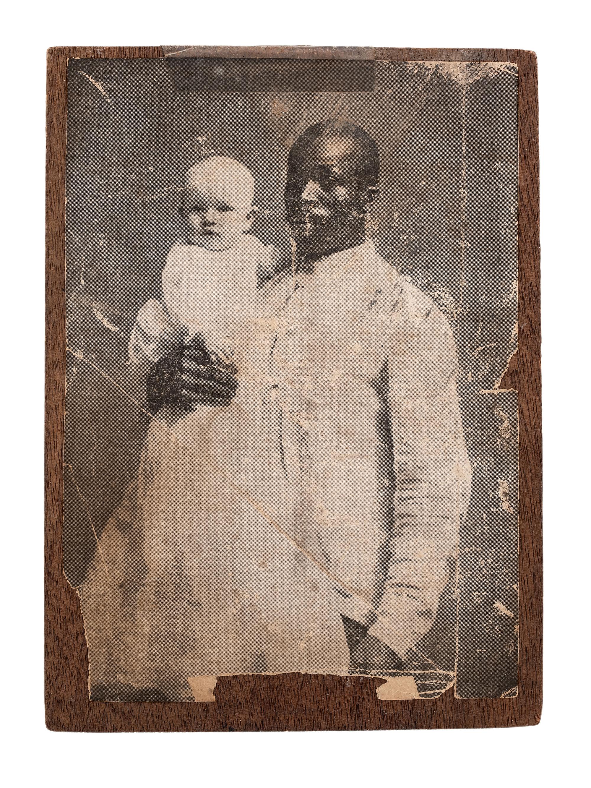 [EARLY PHOTOGRAPHY]. FISHER, AJ, photographer. Printing block for a photograph of an African American butler with white baby.