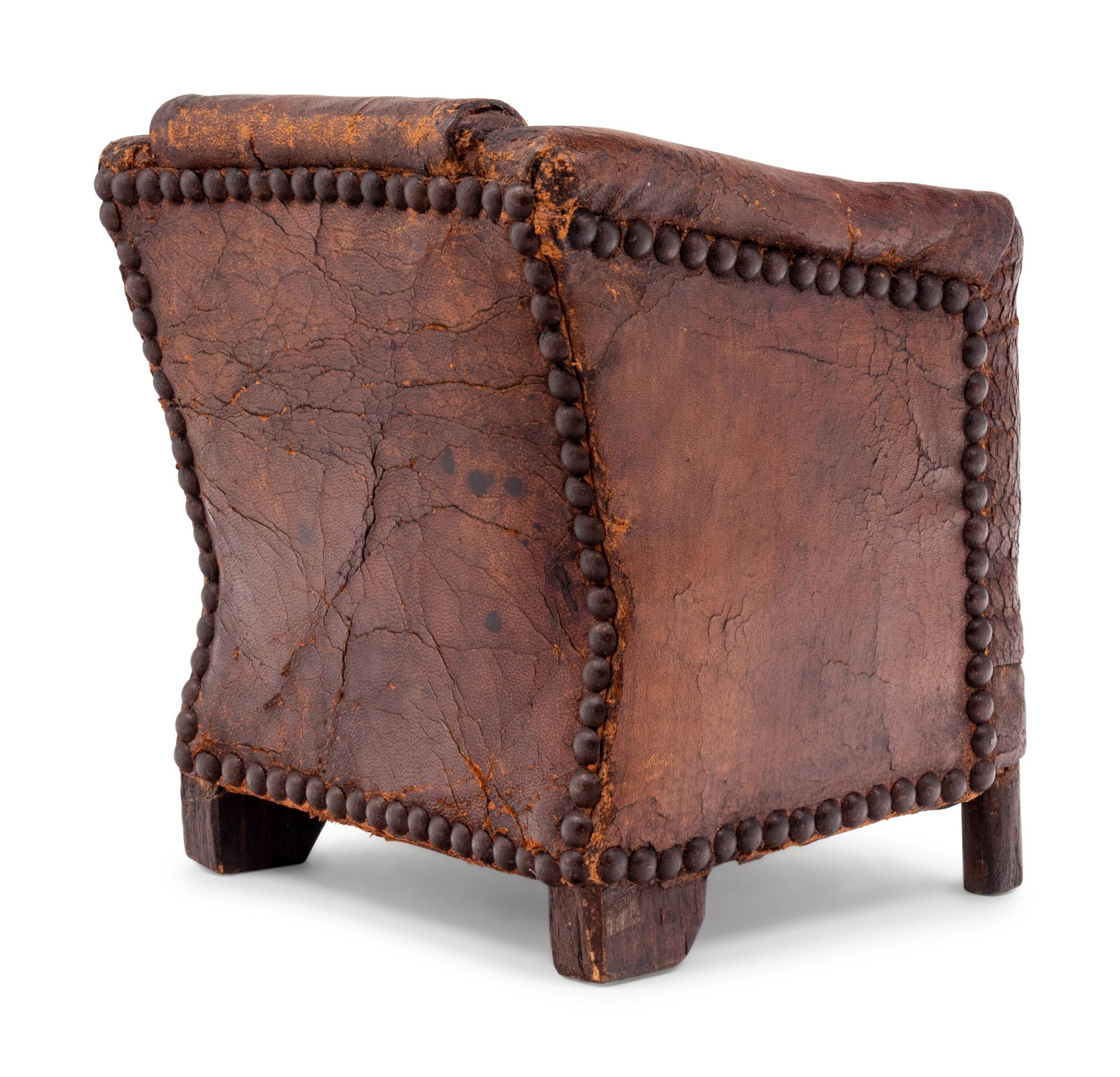 A Diminutive Leather Upholstered Club Chair