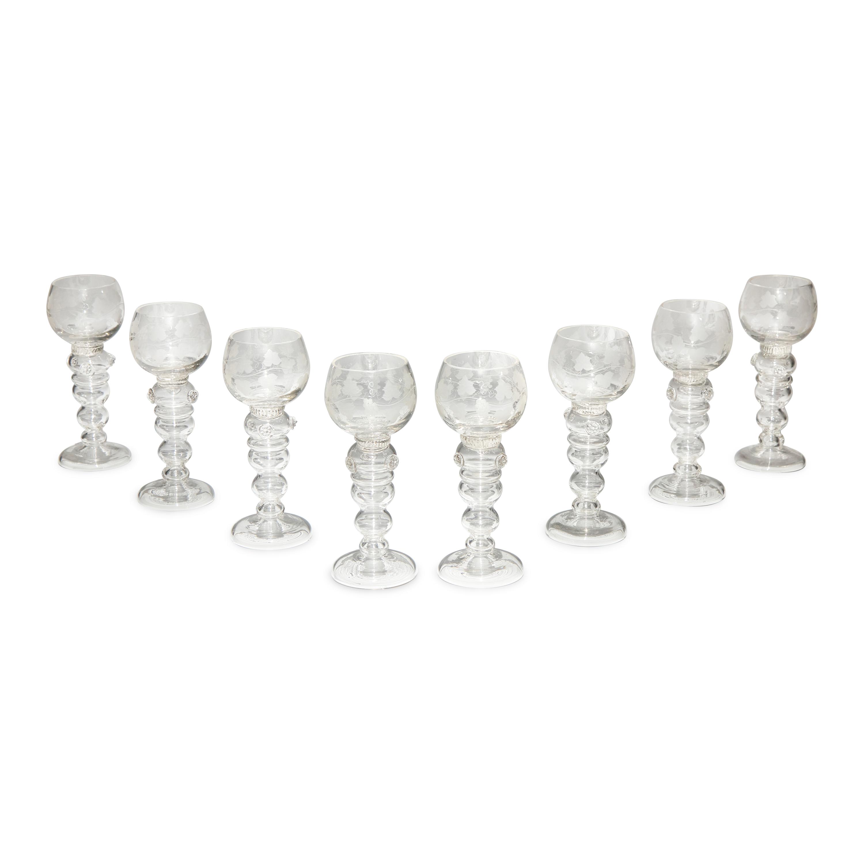 A Set of Eight Blown and Etched Glass Wine Glasses