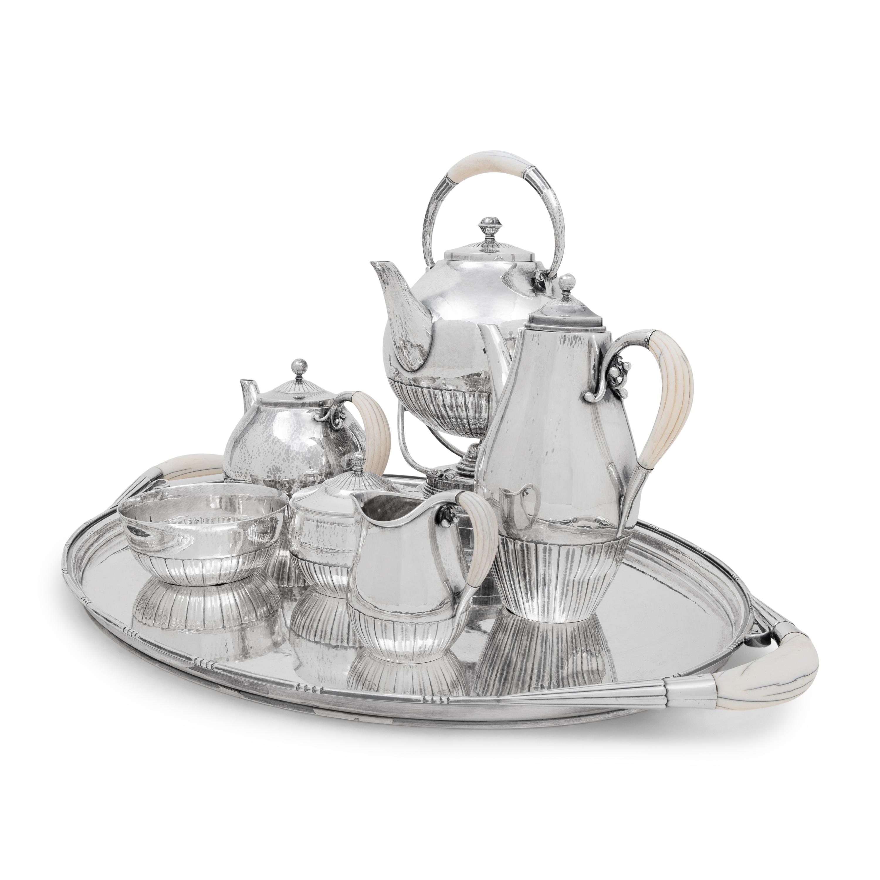 A Georg Jensen Cosmos Seven-Piece Silver Tea and Coffee Service