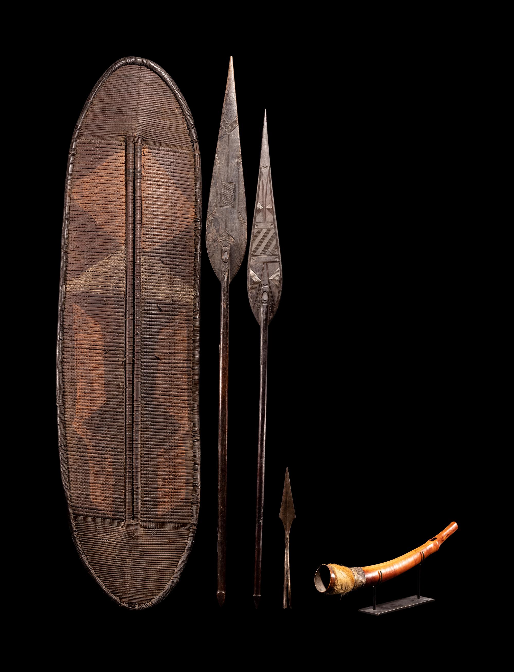 A Ngombe Wicket Shield with Three Spears and a Mbiu Horn