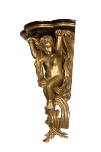 A Gilt Painted Composition and Mahogany Putti-Form Corner Wall Bracket