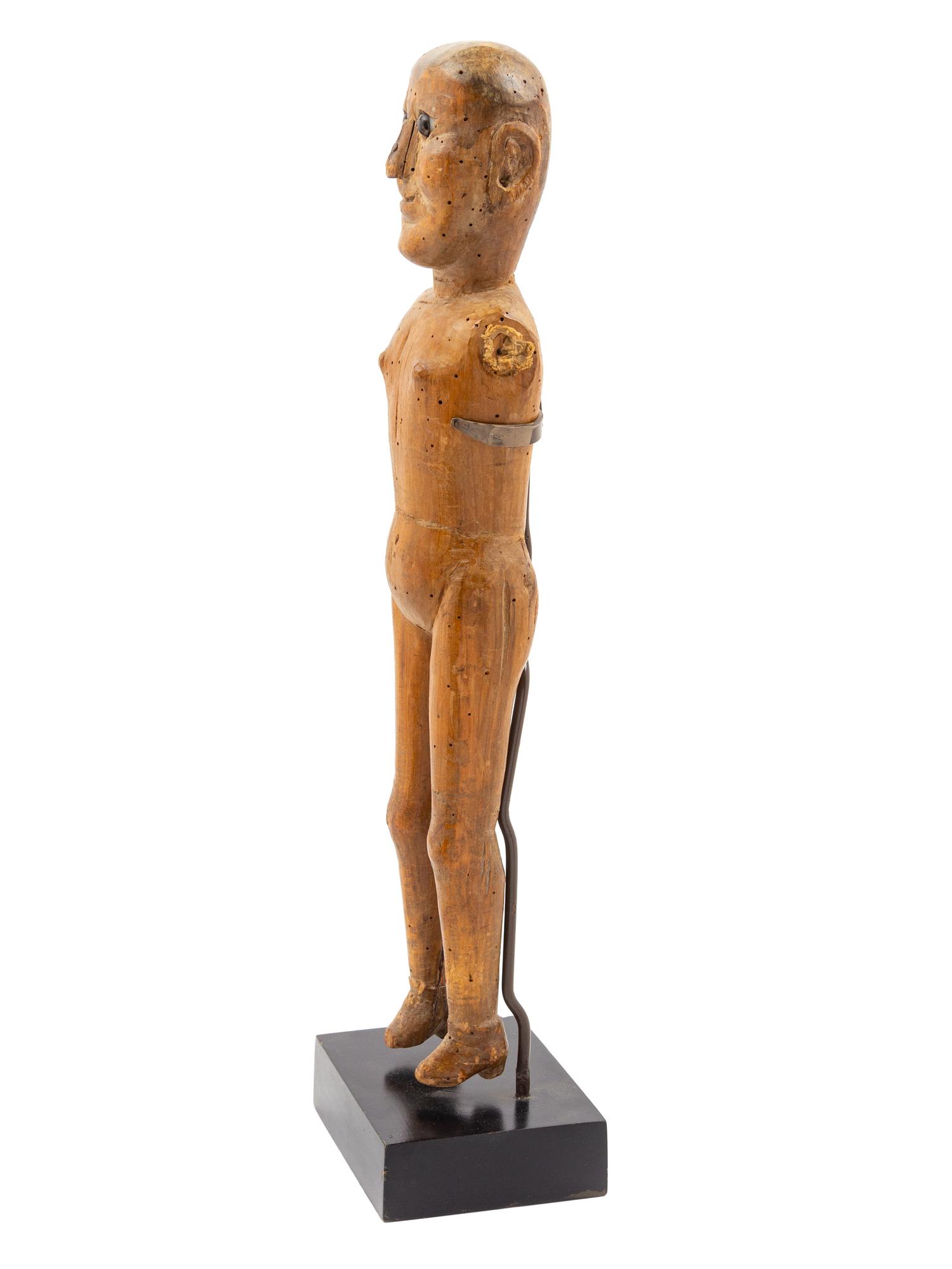 A Carved Wood Figure