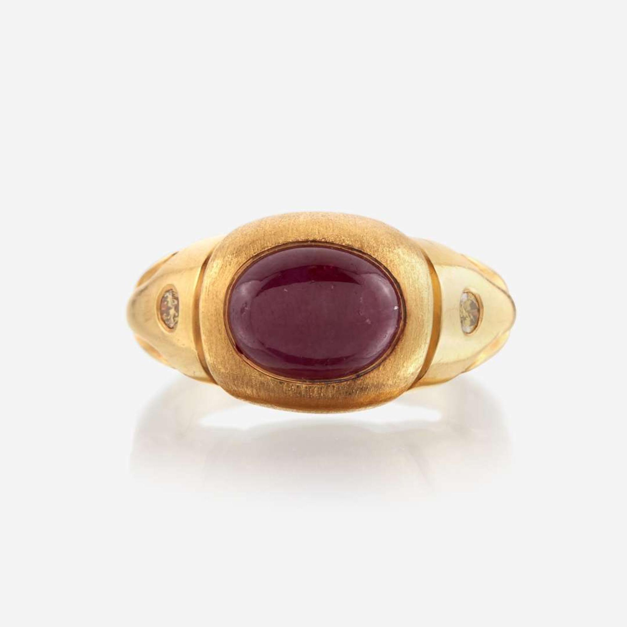 A twenty-two karat gold, ruby, and colored diamond ring