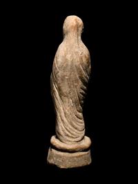 A Greek Terracotta Figure of a Young Woman