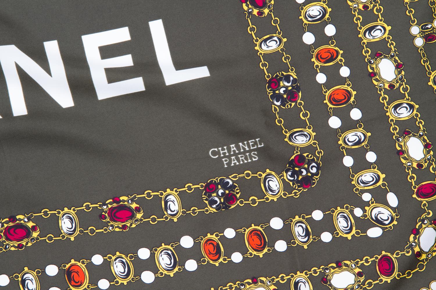 A Chanel Green Silk Scarf, 34" x 34".