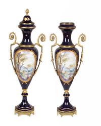 A Pair of Sèvres Style Gilt Metal Mounted Porcelain Covered Urns