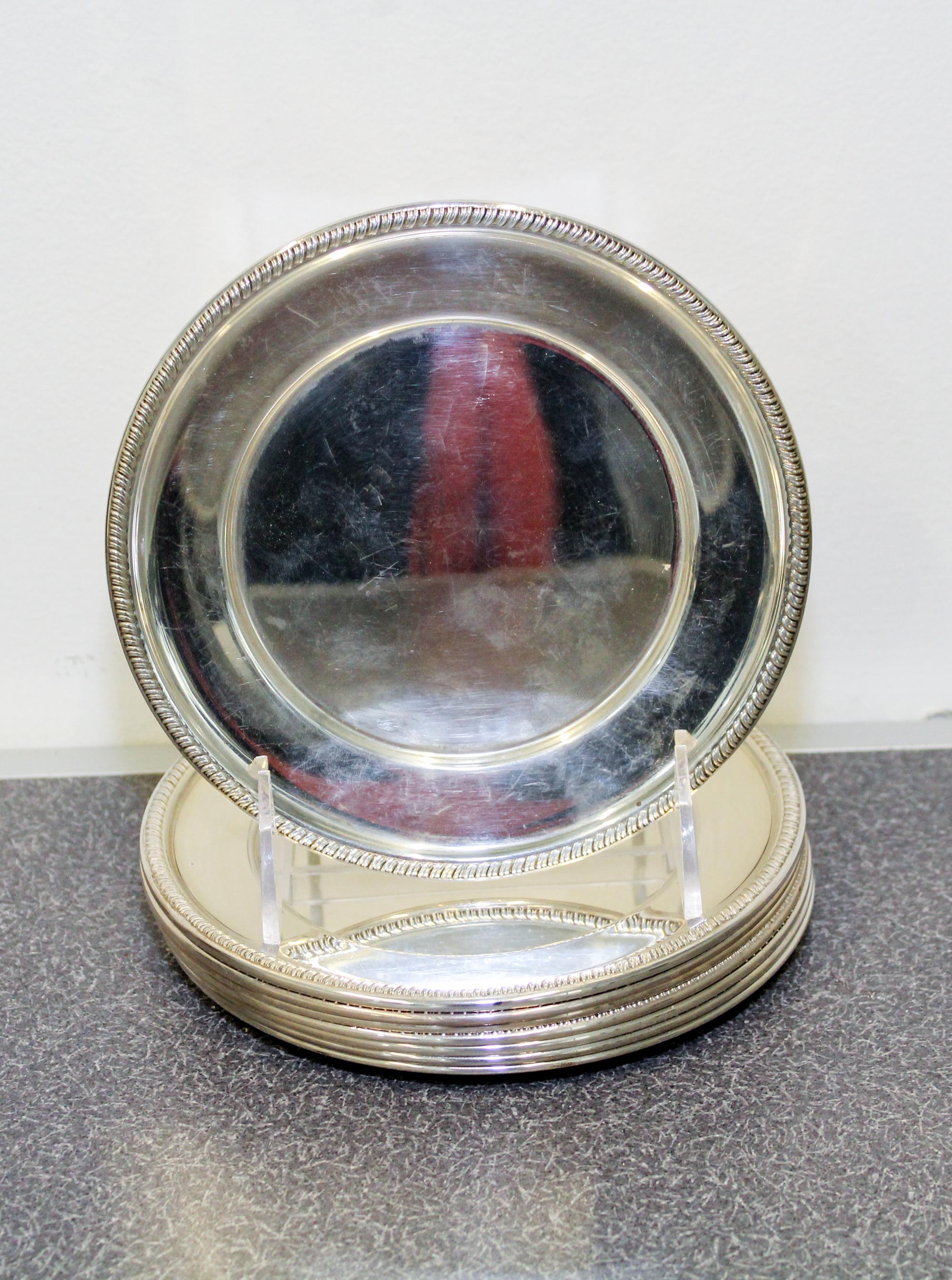 A Set of Eight American Silver Bread Plates, Hunt Silver Co., Chicago, IL, having gadrooned rims.