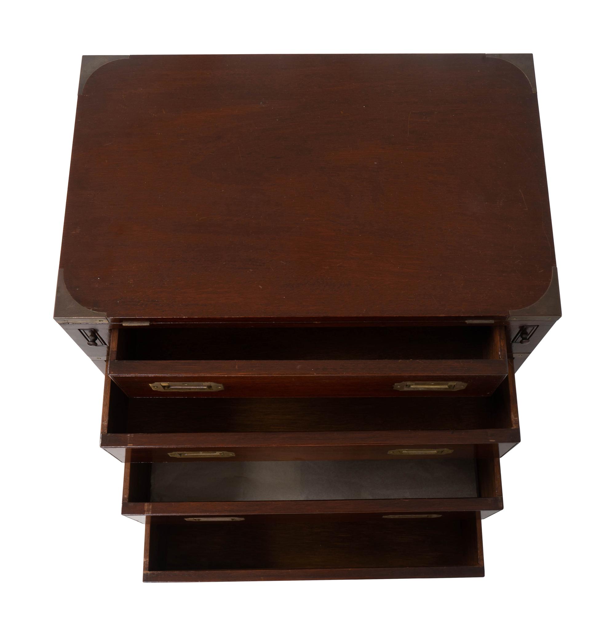 A Diminutive English Campaign Style Brass Mounted Mahogany Chest of Drawers — 20TH CENTURY