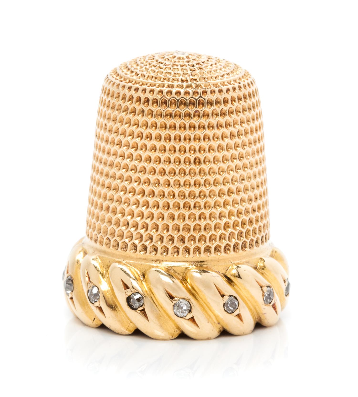 An American 18-Karat Gold and Diamond Thimble, Simons Brothers Co., Philadephia, PA, the knurled top and body above a gadroon band inse