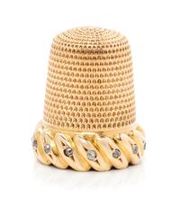 An American 18-Karat Gold and Diamond Thimble, Simons Brothers Co., Philadephia, PA, the knurled top and body above a gadroon band inse