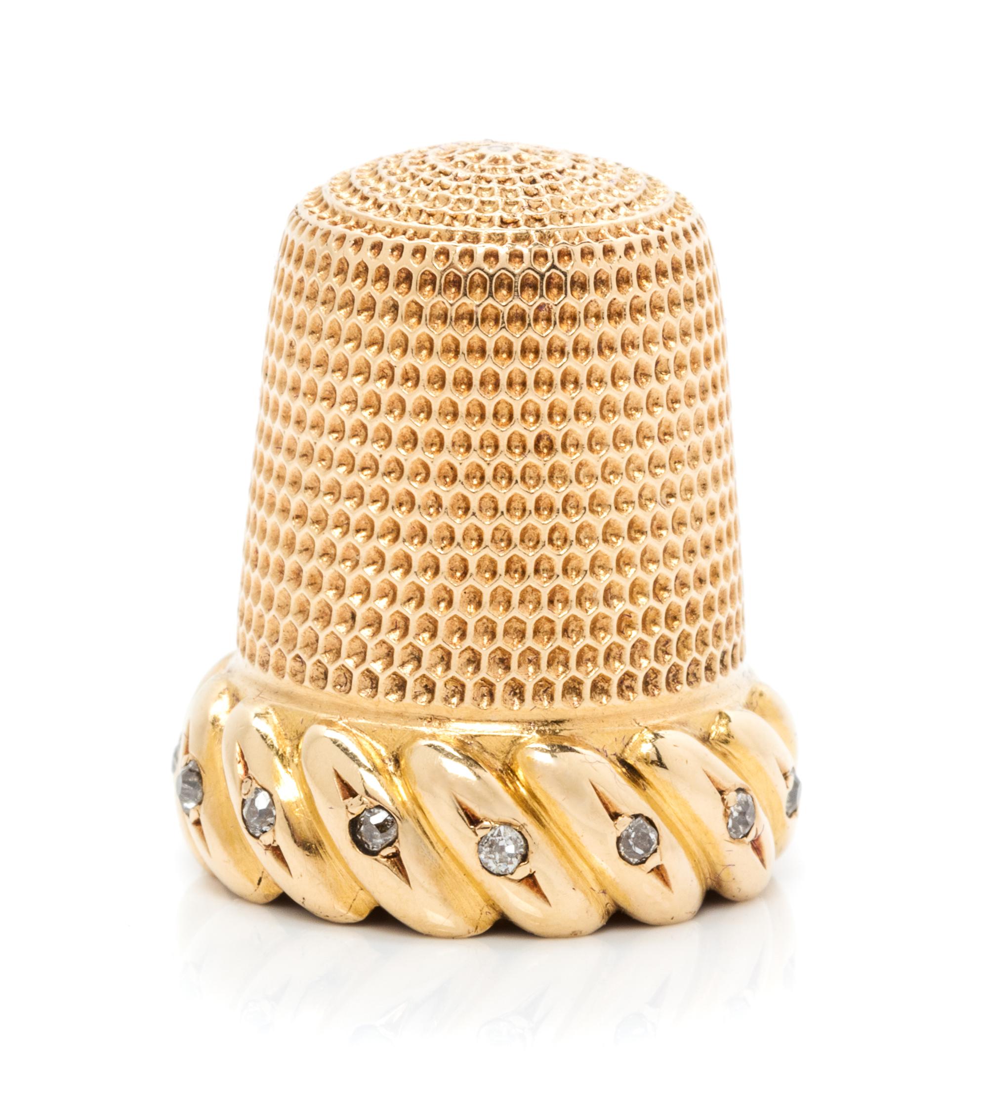 An American 18-Karat Gold and Diamond Thimble, Simons Brothers Co., Philadephia, PA, the knurled top and body above a gadroon band inse