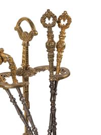 A Set of French Gilt Metal and Iron Fire Tools and Stand