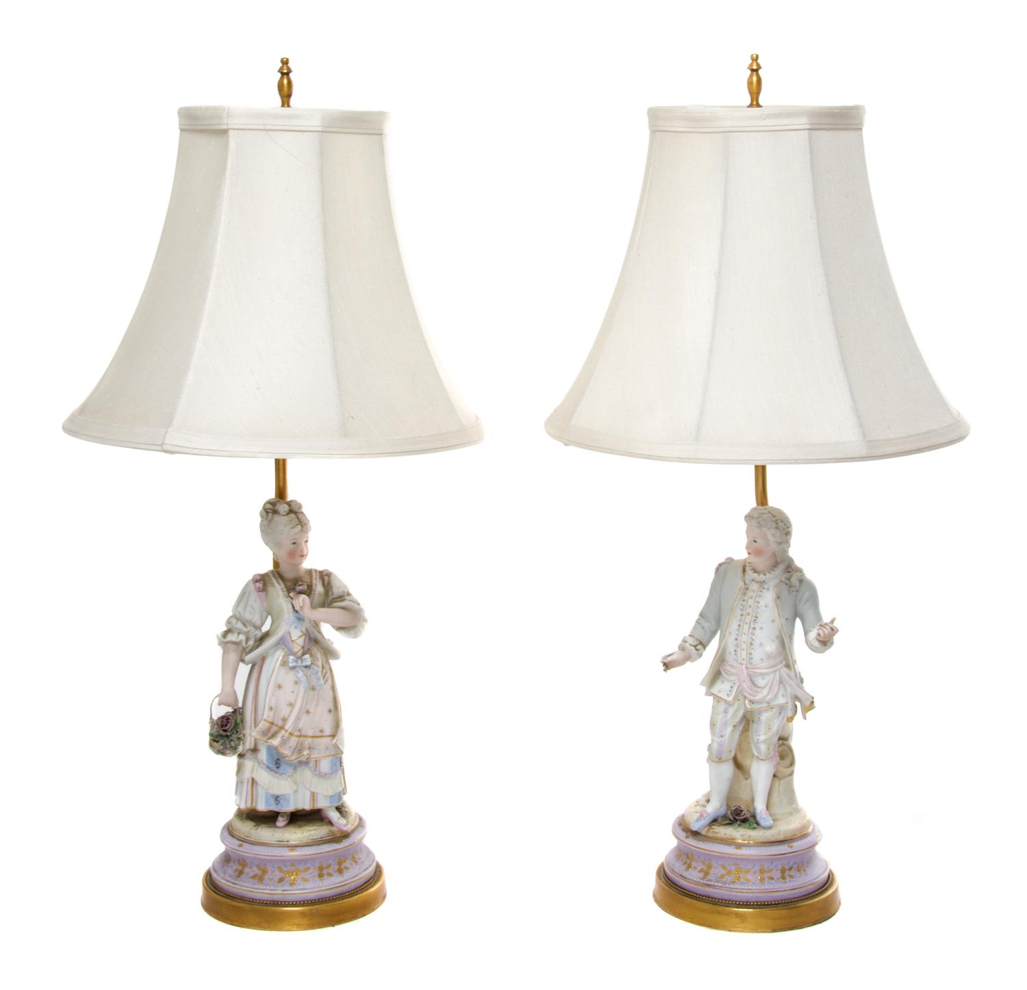 A Pair of Continental Bisque Porcelain Figures Height 11 inches.