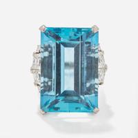 A Ladies Platinum and Aquamarine Diamond Ring