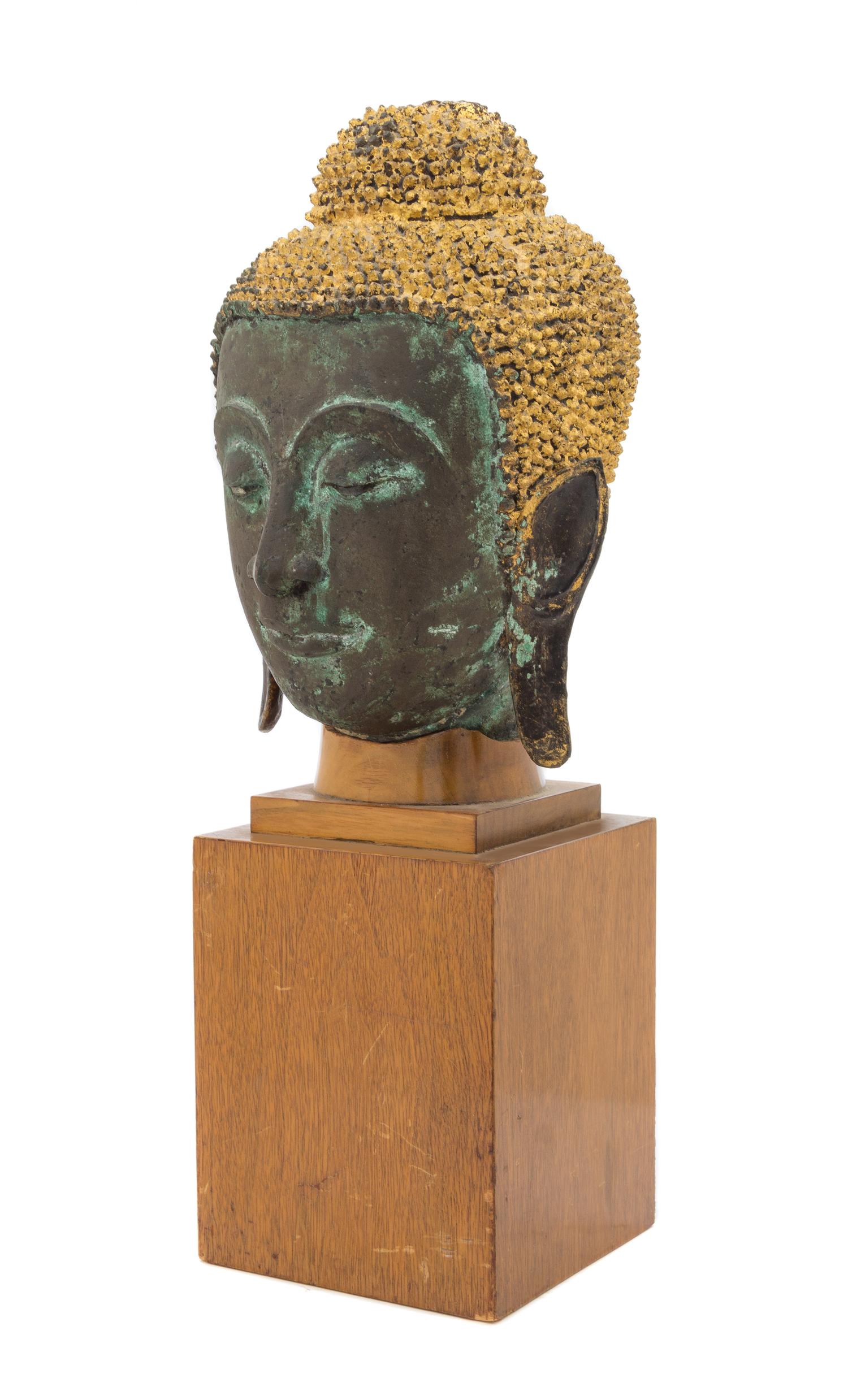 A Thai Parcel Gilt Bronze Buddha Head 18TH CENTURY OR EARLIER Height of head 12 1/2 inches. — 18TH CENTURY OR EARLIER