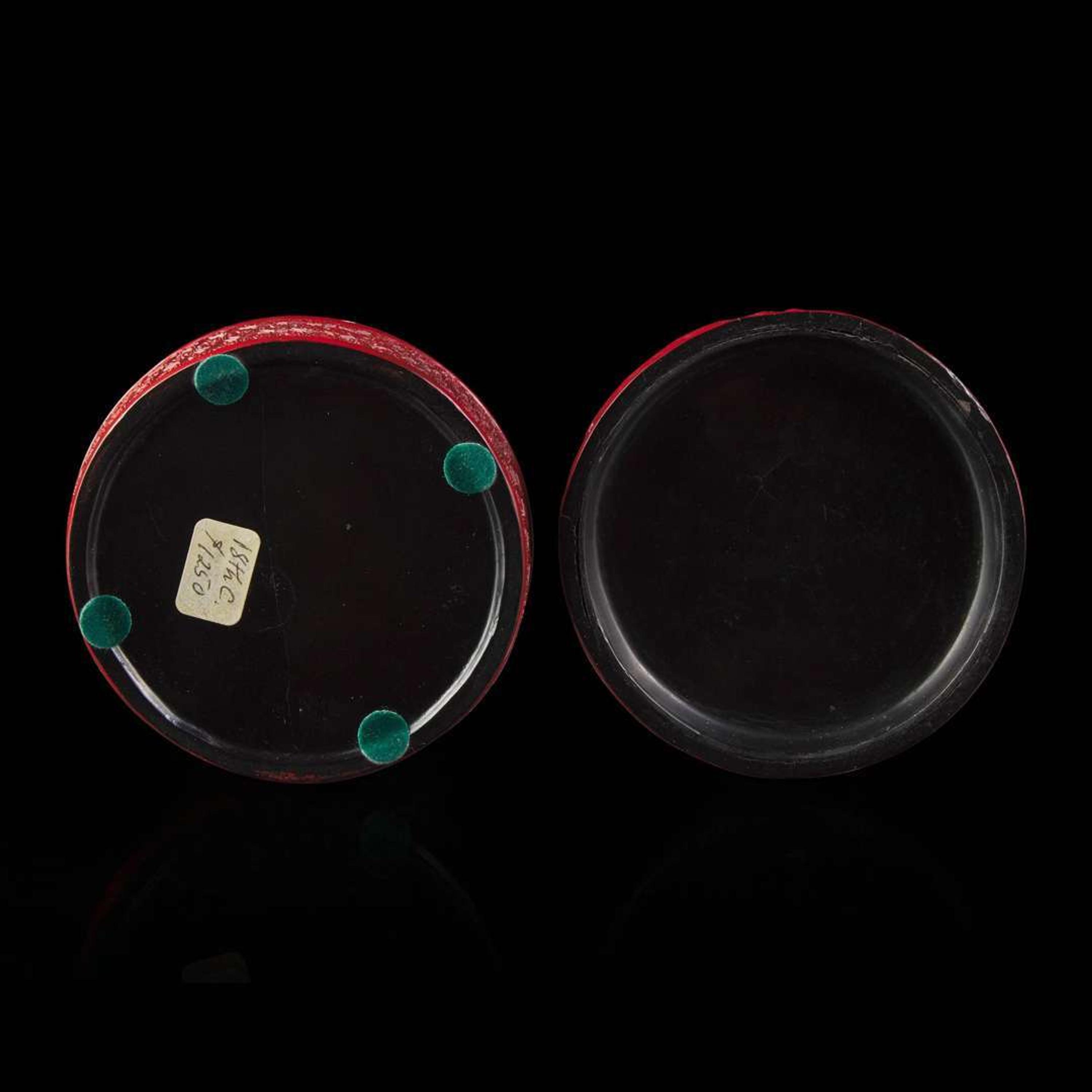 An associated pair of Chinese carved cinnabar lacquer dishes, and a small circular box 大漆 盘子或一对及一小盖盒