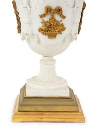 A Pair of Continental Bisque Porcelain Urns with Gilt Metal Mounts
