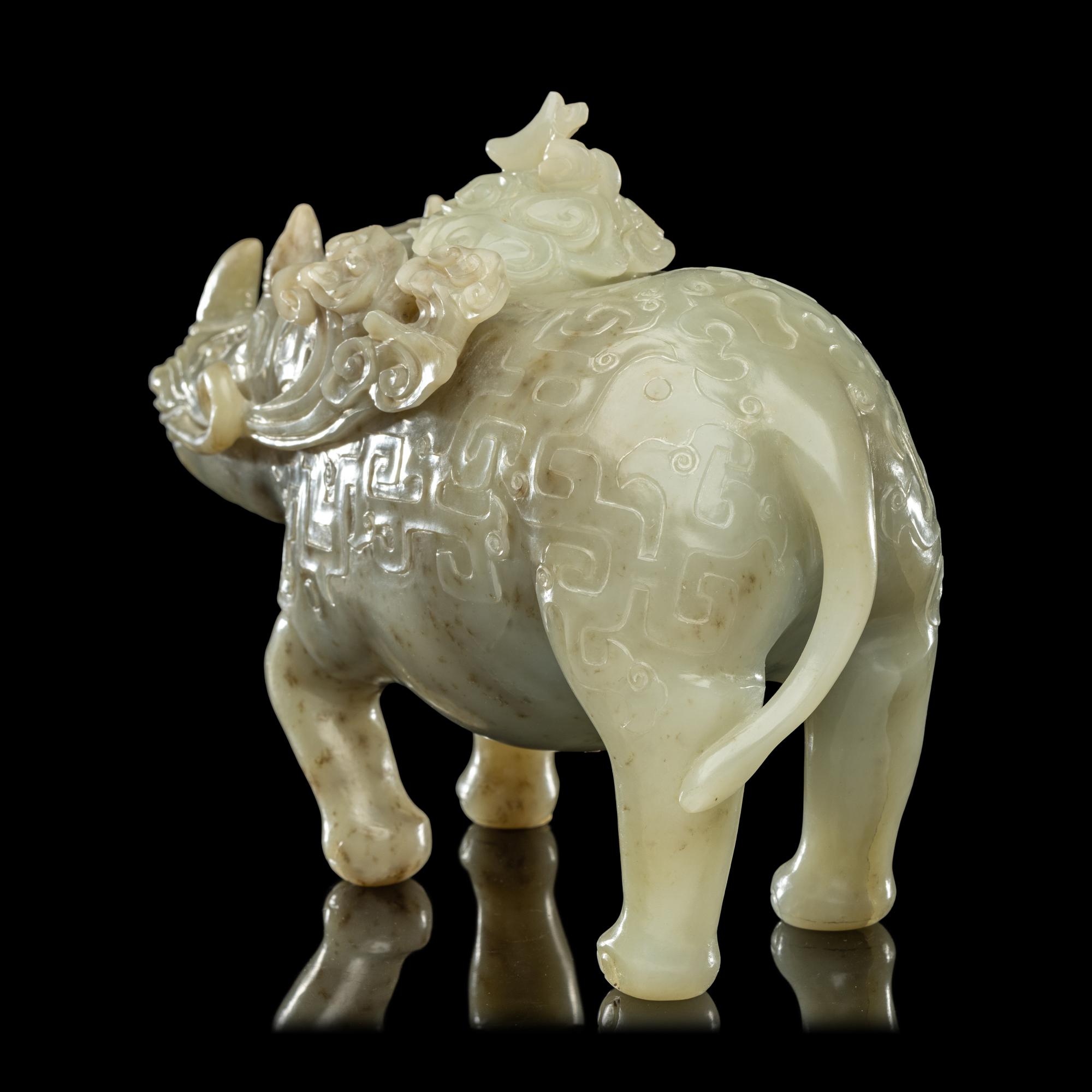 A Chinese Carved Celadon Jade Archaistic Rhinoceros-Form Covered Vessel, 20th Century 近代 青玉仿古犀尊