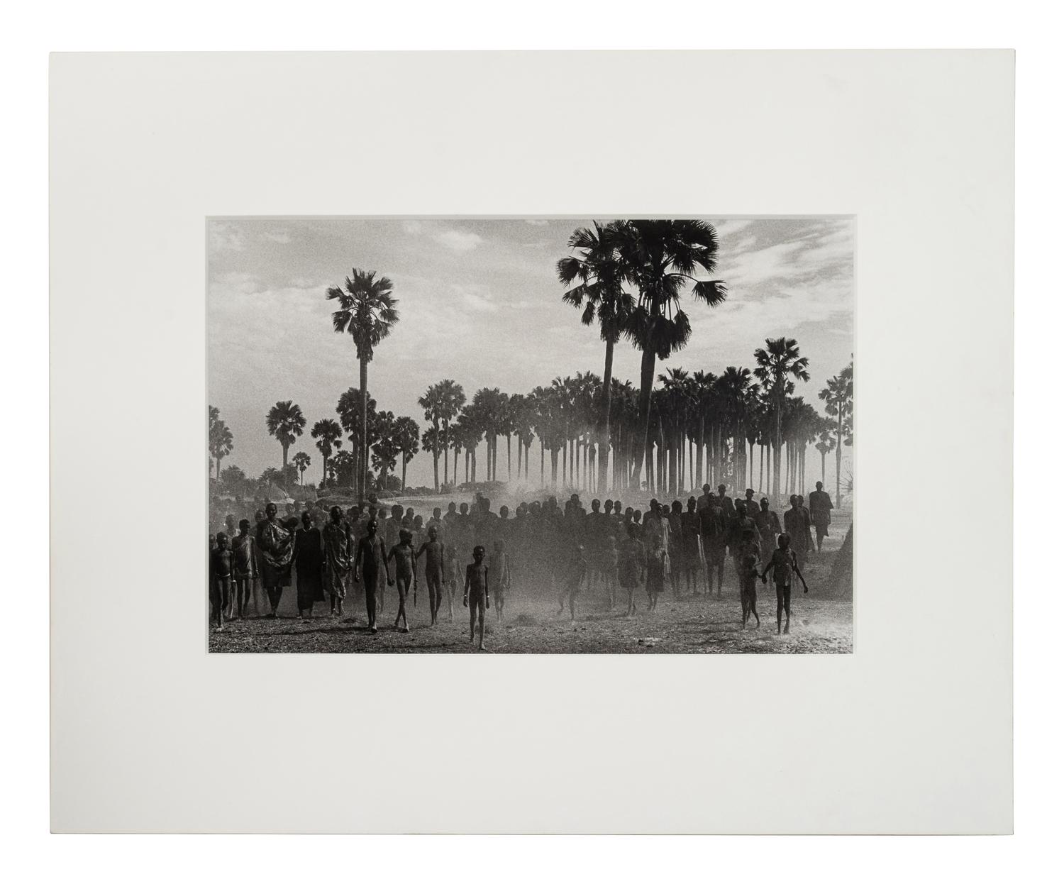 Sebastião Salgado (born 1944) The population of the cattle camp of Kenya walk toward the polio vaccinators as soon as they arrive, Maper Payem area, Rumbek District, Southern Sudan, 2001