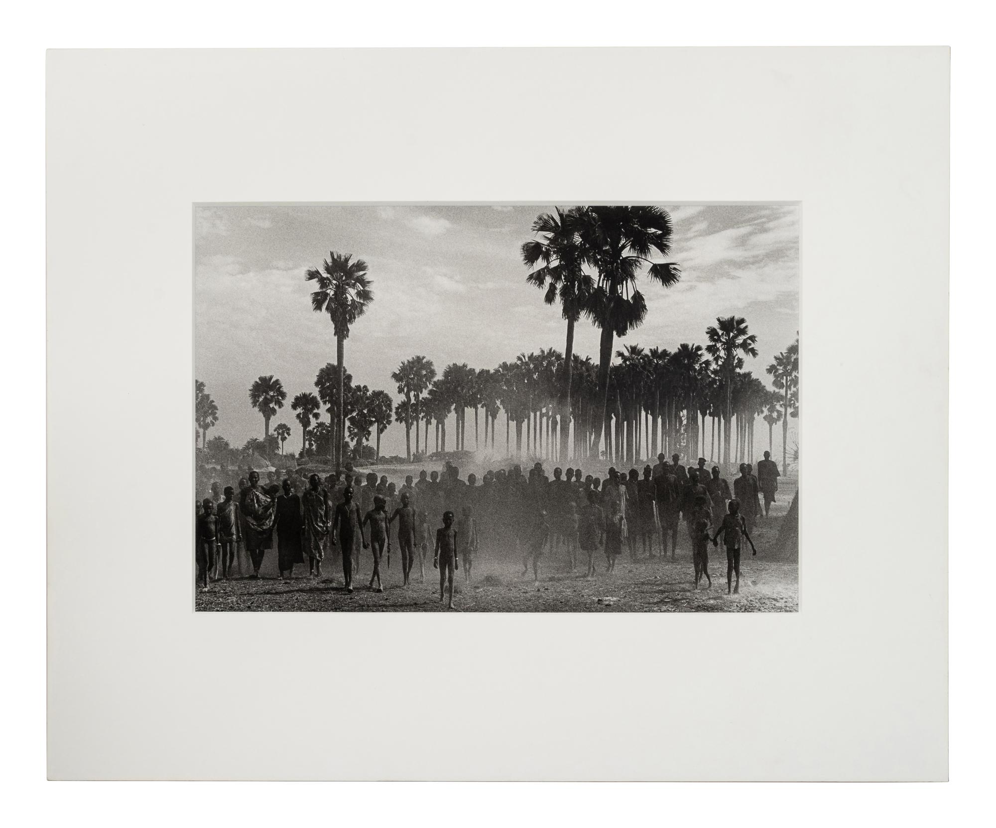 Sebastião Salgado (born 1944) The population of the cattle camp of Kenya walk toward the polio vaccinators as soon as they arrive, Maper Payem area, Rumbek District, Southern Sudan, 2001