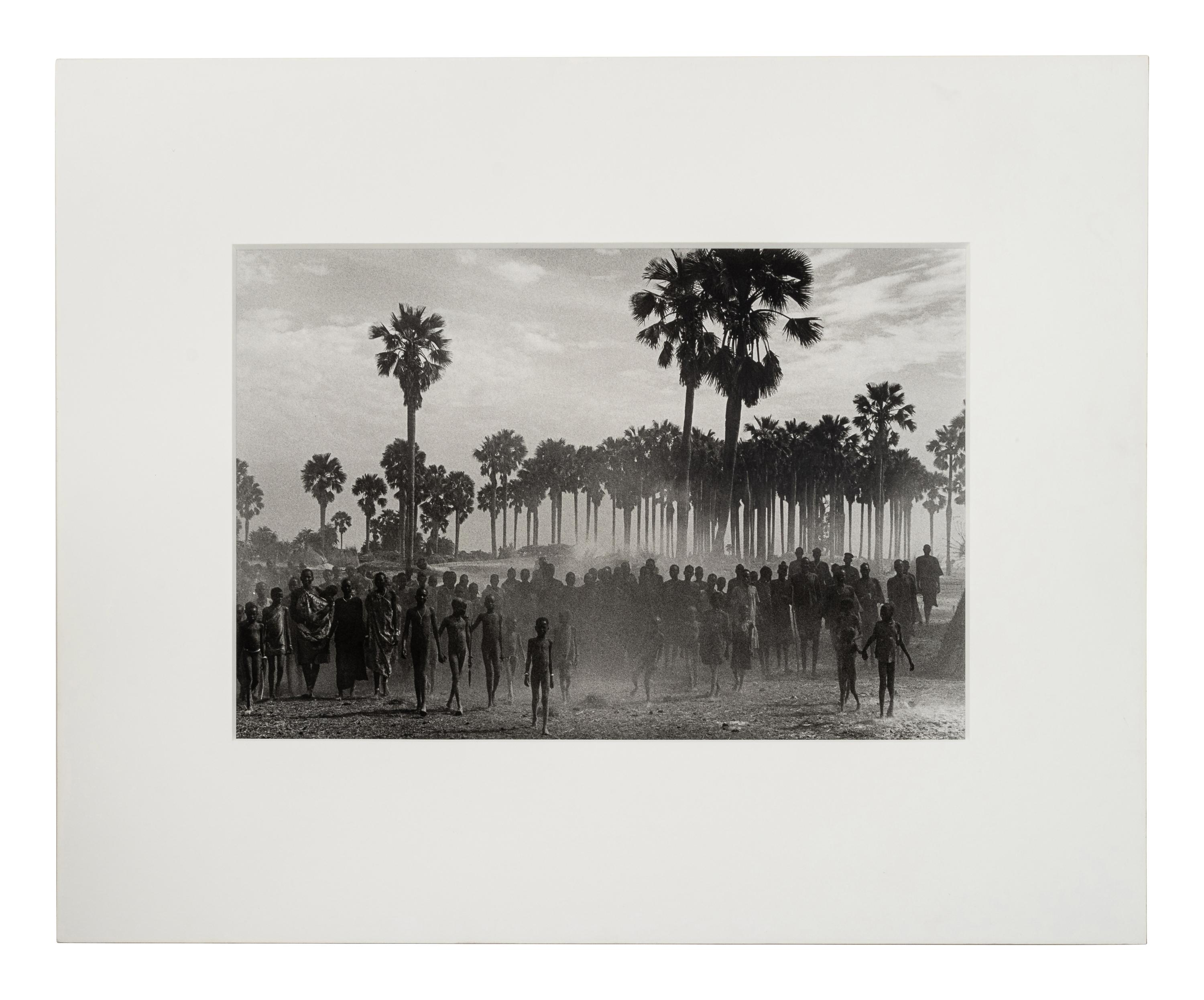 Sebastião Salgado (born 1944) The population of the cattle camp of Kenya walk toward the polio vaccinators as soon as they arrive, Maper Payem area, Rumbek District, Southern Sudan, 2001