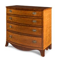 A George III Maple, Satinwood and Mahogany Bowfront Chest of Drawers