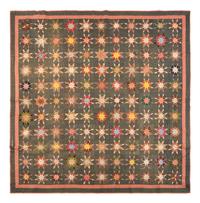 A Pieced Printed Cotton 'Eight Pointed Star' Variation Pattern Quilt