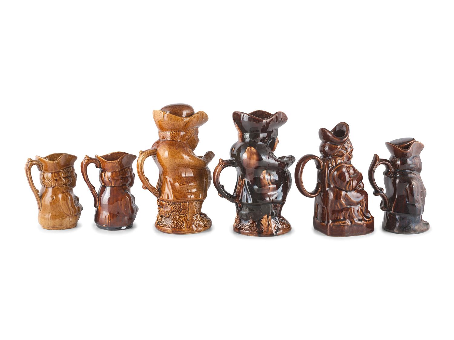 Six Toby Jugs in Rockingham Glaze
