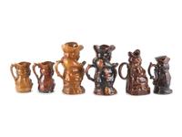 Six Toby Jugs in Rockingham Glaze