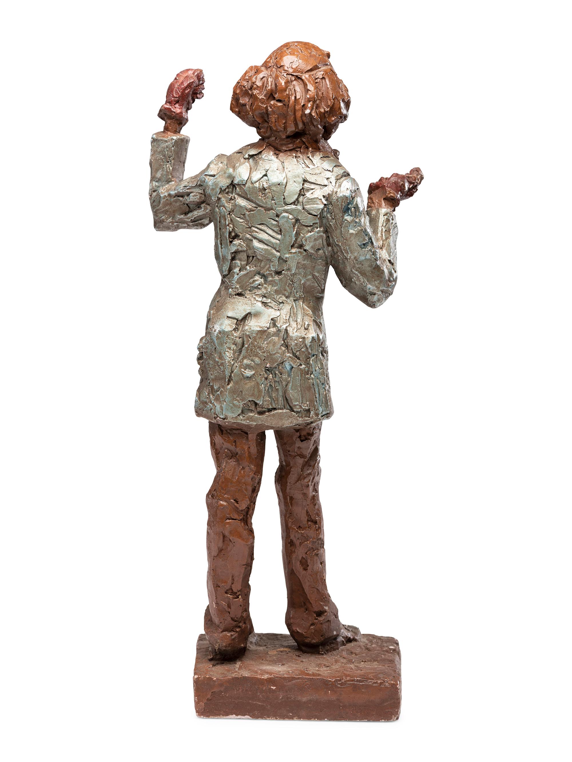 A Carved and Painted Plaster Folk Art Sculpture of a Standing Man
