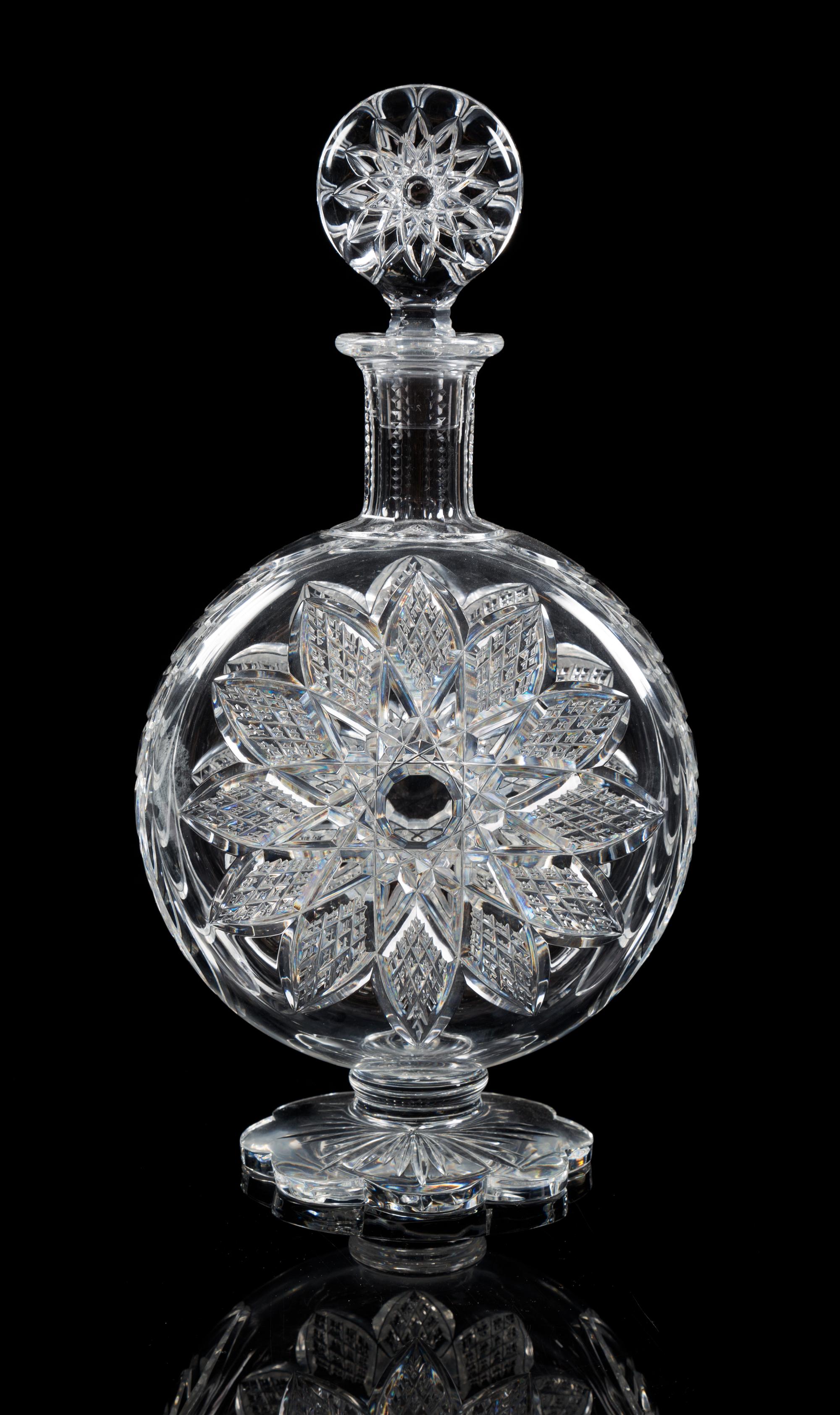 Baccarat, a cut glass decanter, the stopper and body cut similar star patterns