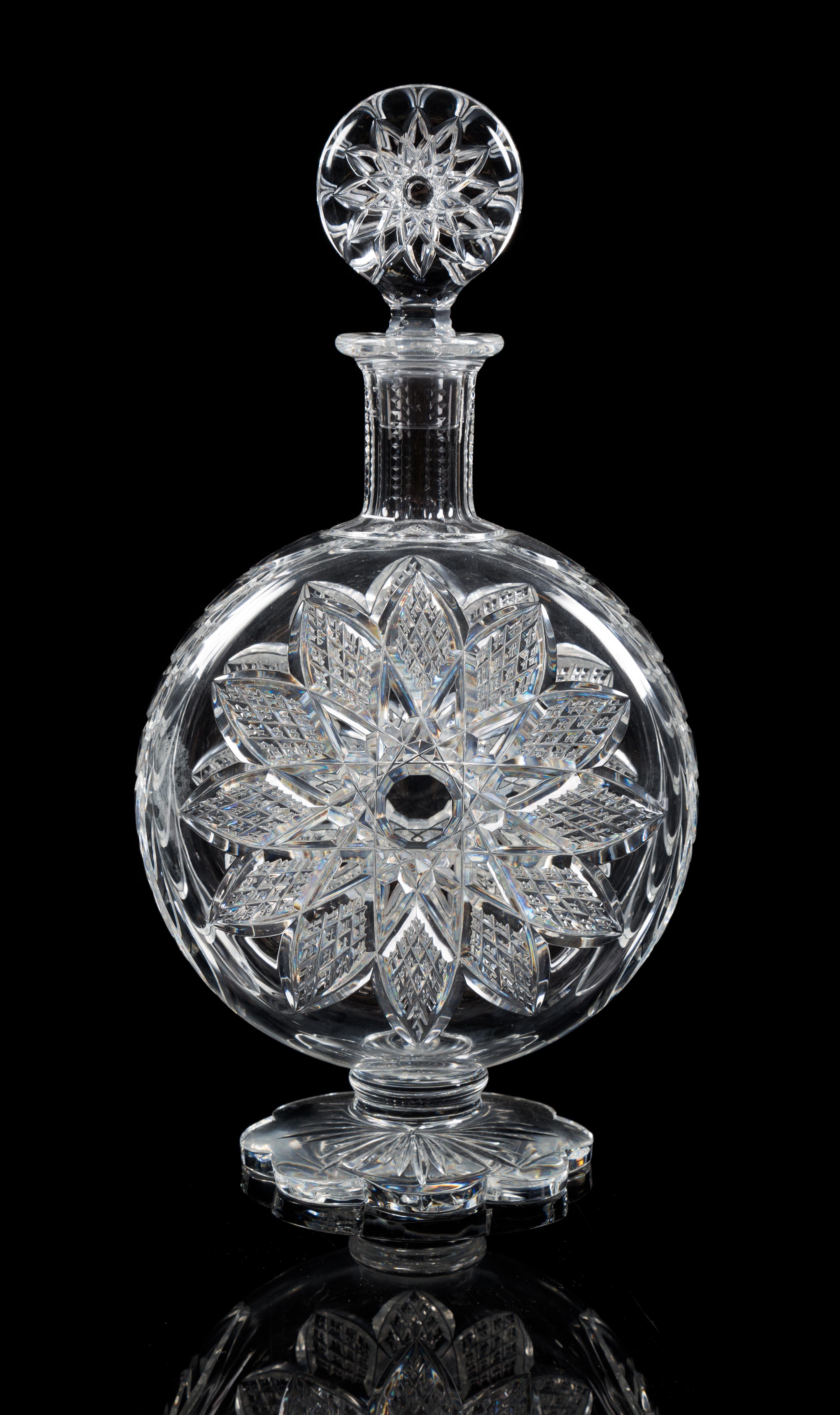 Baccarat, a cut glass decanter, the stopper and body cut similar star patterns