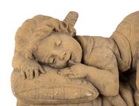 A Concrete Garden Sculpture of a Sleeping Girl